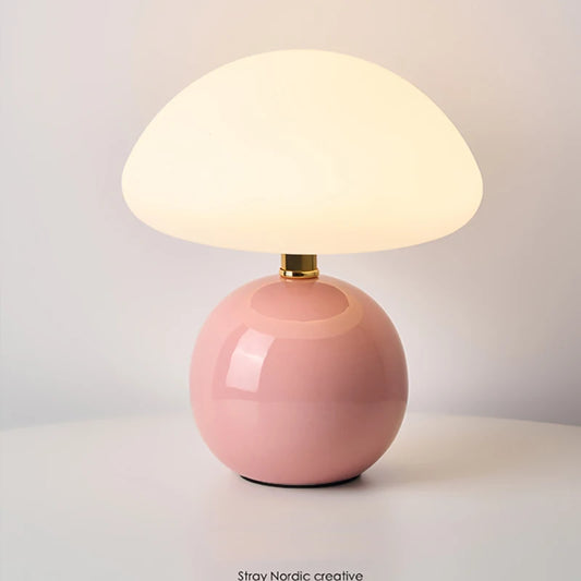 Cream mushroom table lamp on a bedside table