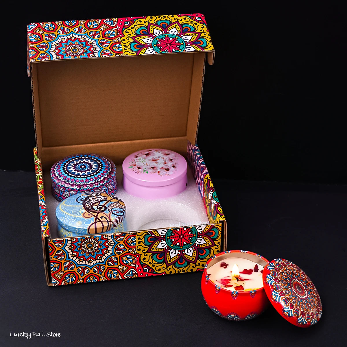 Set of four scented candle jars with dried flowers and crystal stones