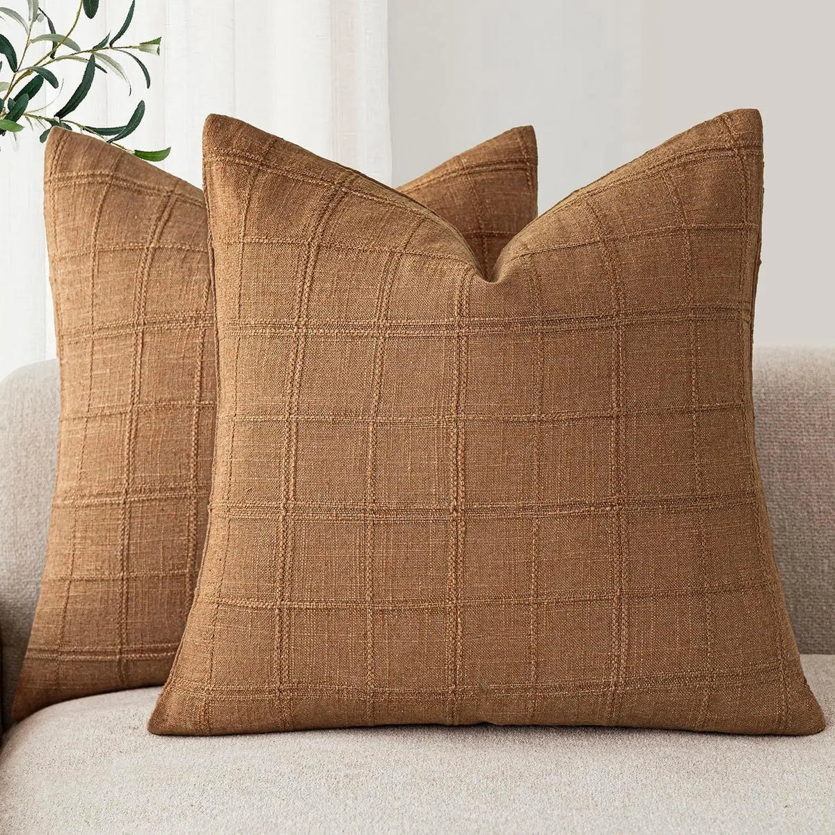 Boho check cushion cover on a sofa