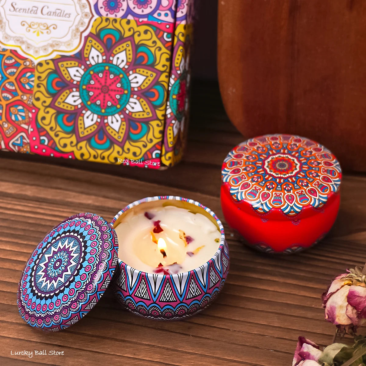 Set of four scented candle jars with dried flowers and crystal stones