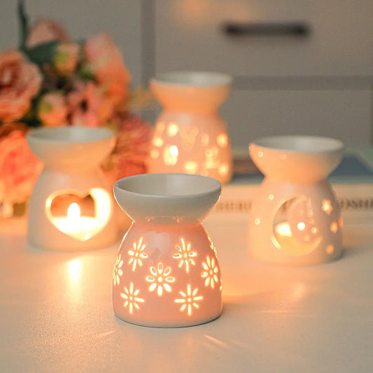 White ceramic oil burner with cut-out pattern
