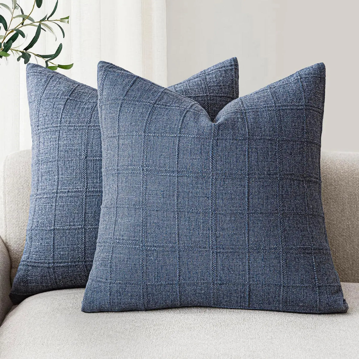 Boho check cushion cover on a sofa