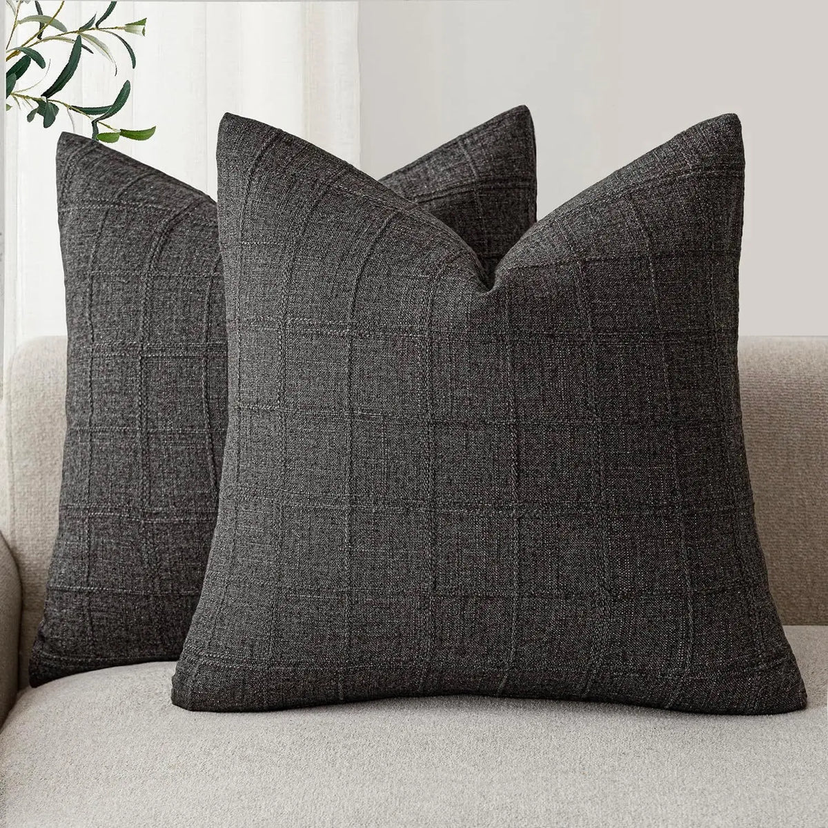 Boho check cushion cover on a sofa