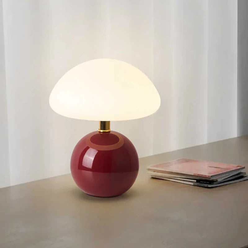 Cream mushroom table lamp on a bedside table
