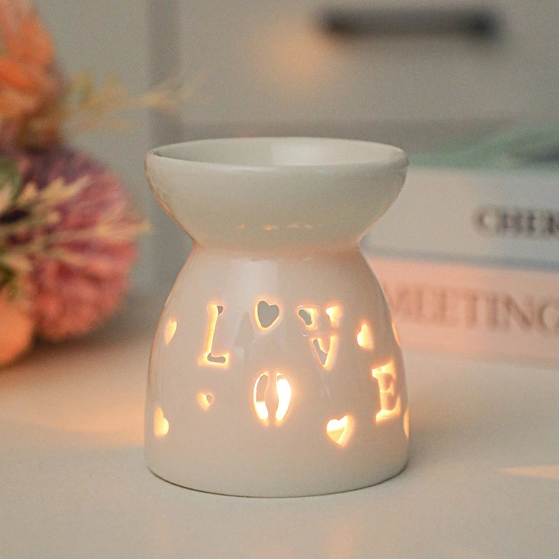 White ceramic oil burner with cut-out pattern