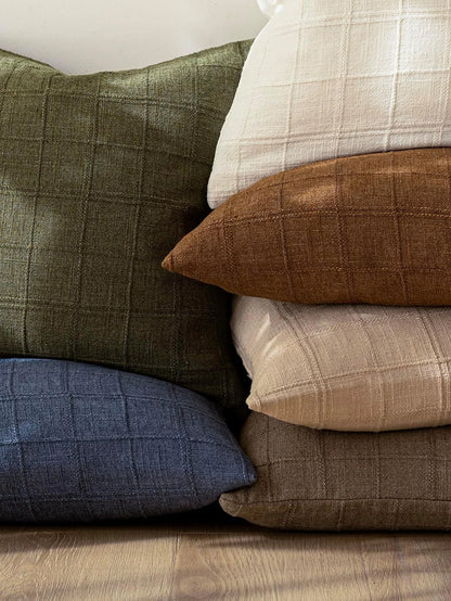 Boho check cushion cover on a sofa
