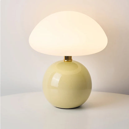 Cream mushroom table lamp on a bedside table