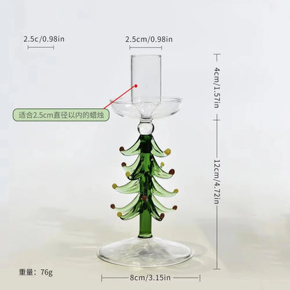 Glass Christmas tree candle holder on a festive table