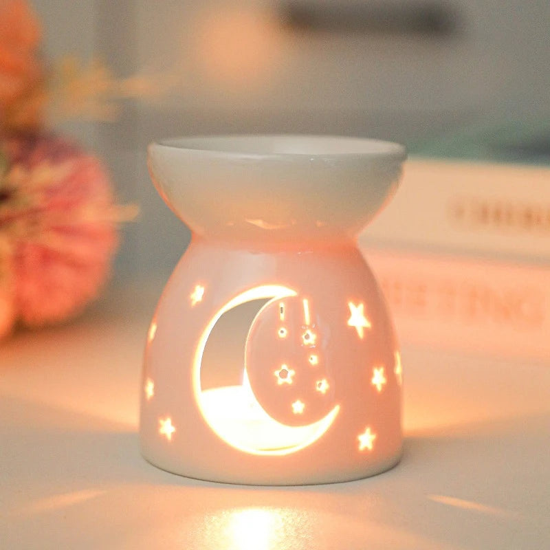 White ceramic oil burner with cut-out pattern