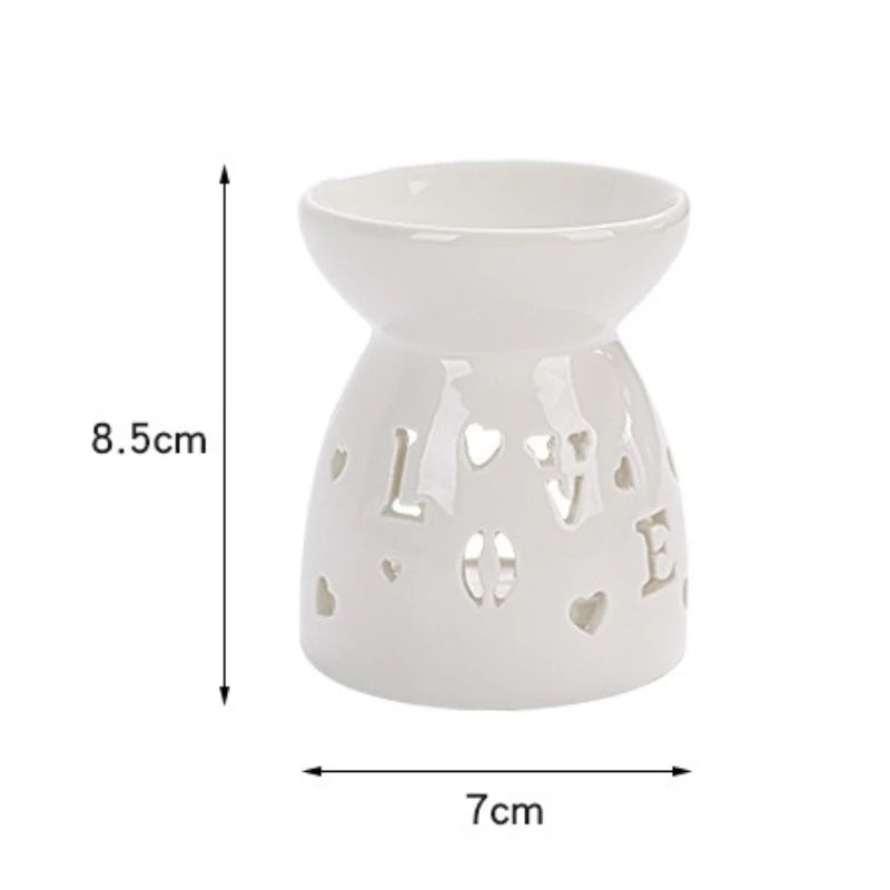 White ceramic oil burner with cut-out pattern
