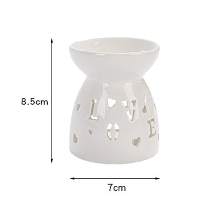 White ceramic oil burner with cut-out pattern