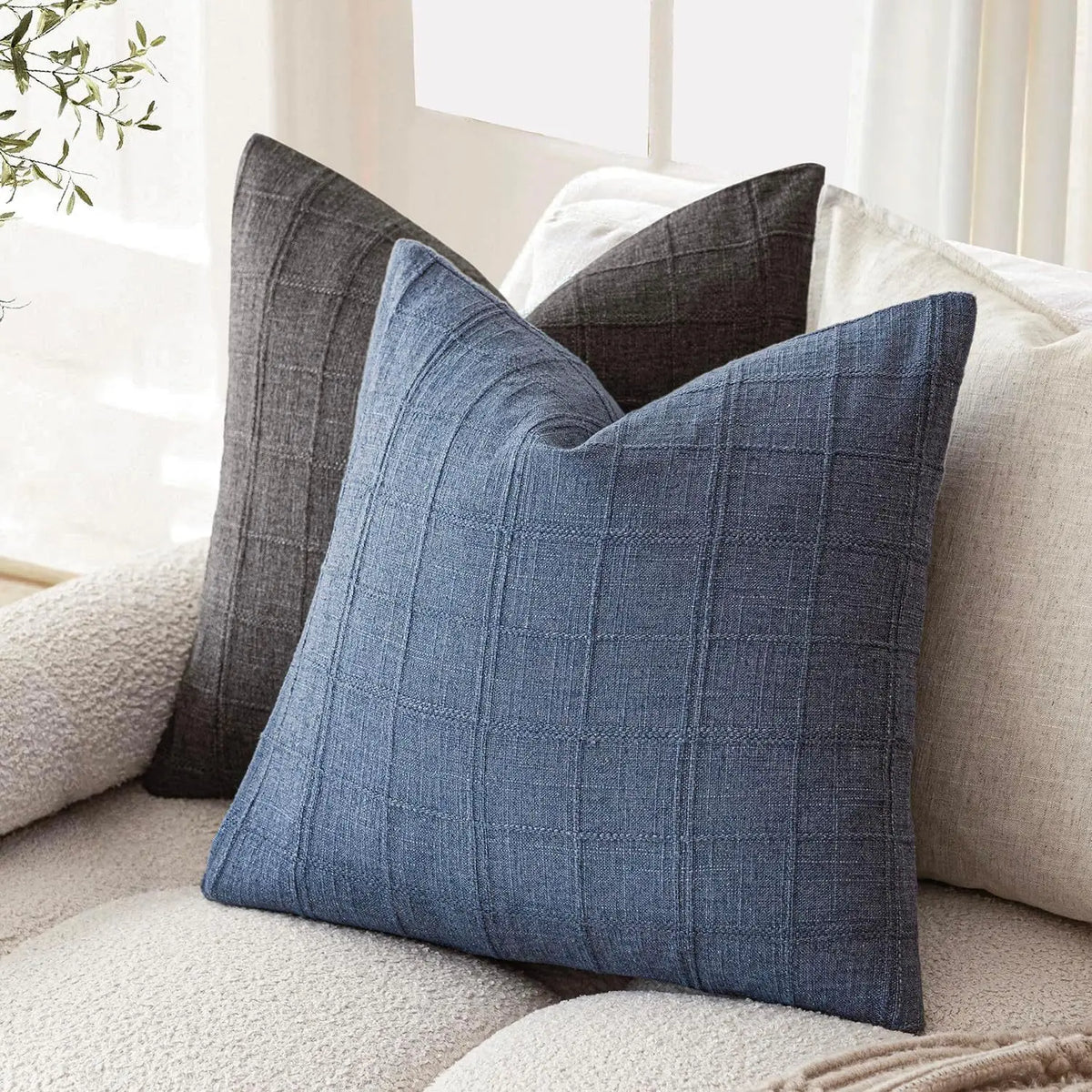 Boho check cushion cover on a sofa