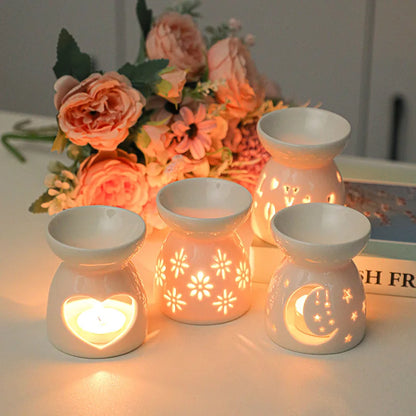 White ceramic oil burner with cut-out pattern