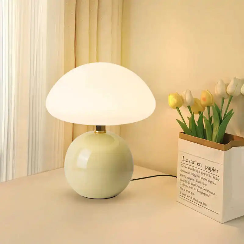 Cream mushroom table lamp on a bedside table
