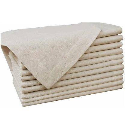 Set of six natural cloth dinner napkins on a table