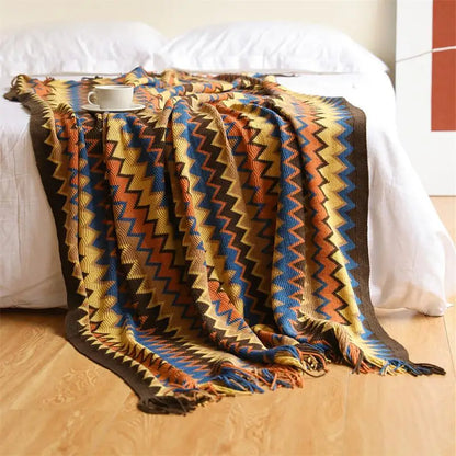 Hand-knitted boho tassel throw blanket