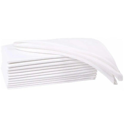 Set of six natural cloth dinner napkins on a table
