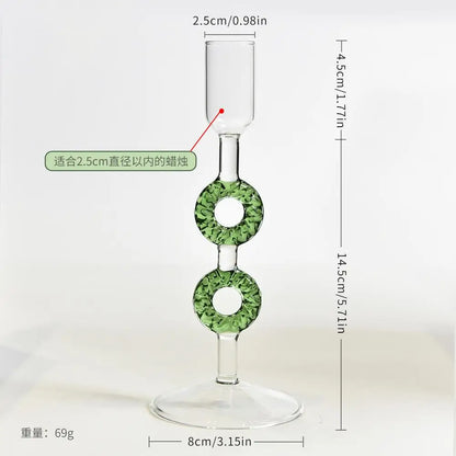 Glass Christmas tree candle holder on a festive table