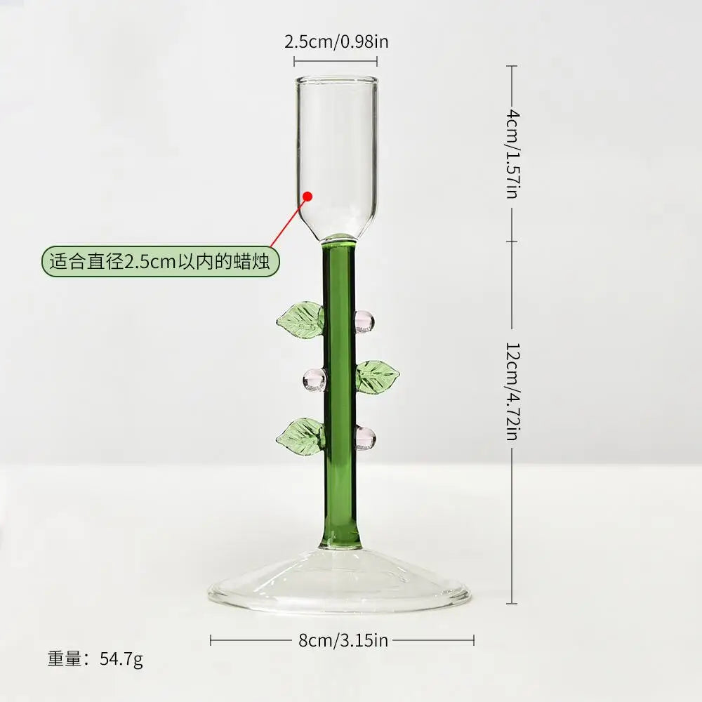 Glass Christmas tree candle holder on a festive table
