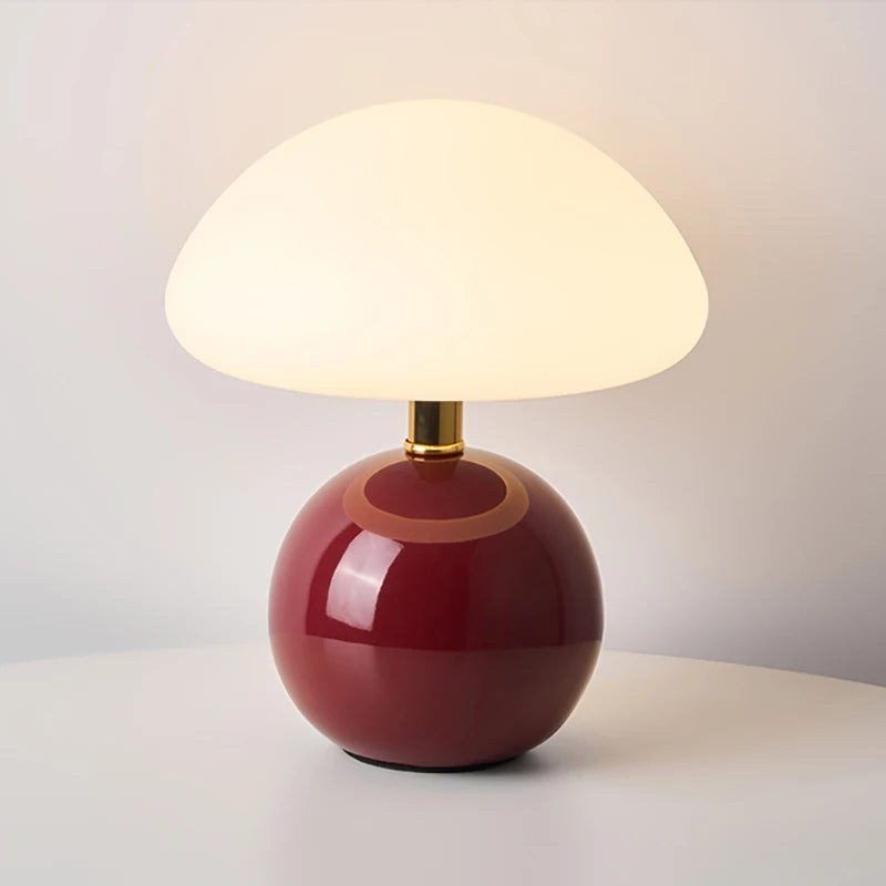 Cream mushroom table lamp on a bedside table