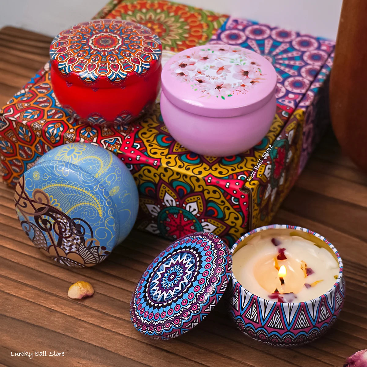 Set of four scented candle jars with dried flowers and crystal stones