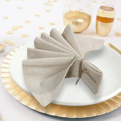 Set of six natural cloth dinner napkins on a table