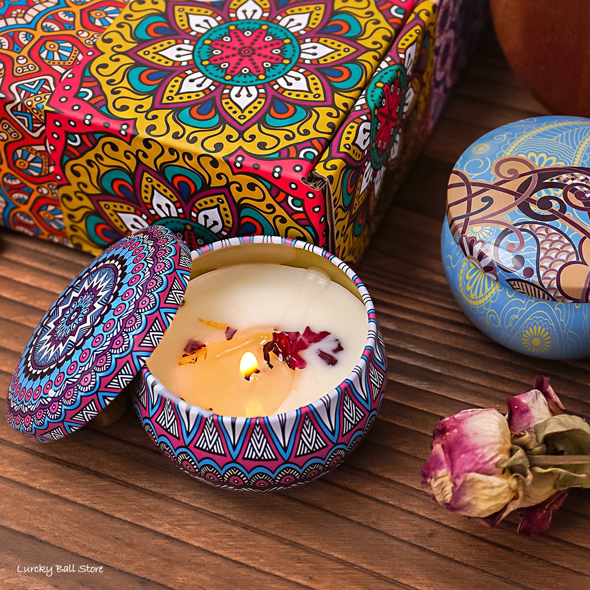 Set of four scented candle jars with dried flowers and crystal stones