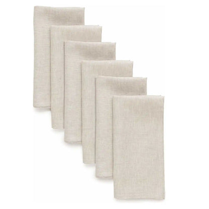 Set of six natural cloth dinner napkins on a table