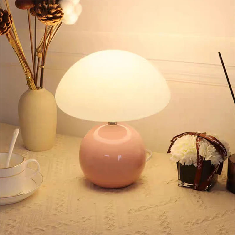 Cream mushroom table lamp on a bedside table
