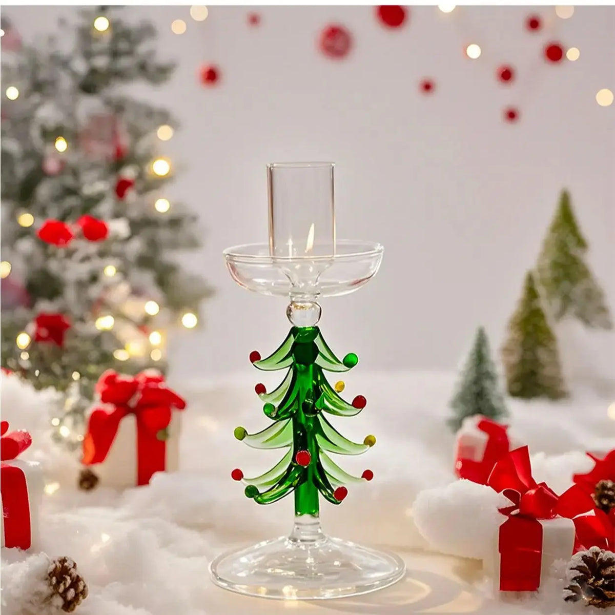 Glass Christmas tree candle holder on a festive table
