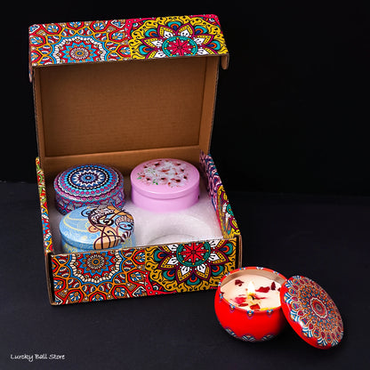Set of four scented candle jars with dried flowers and crystal stones